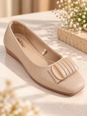 Women’s beige wedge ballet flats with textured finish and buckle detail
